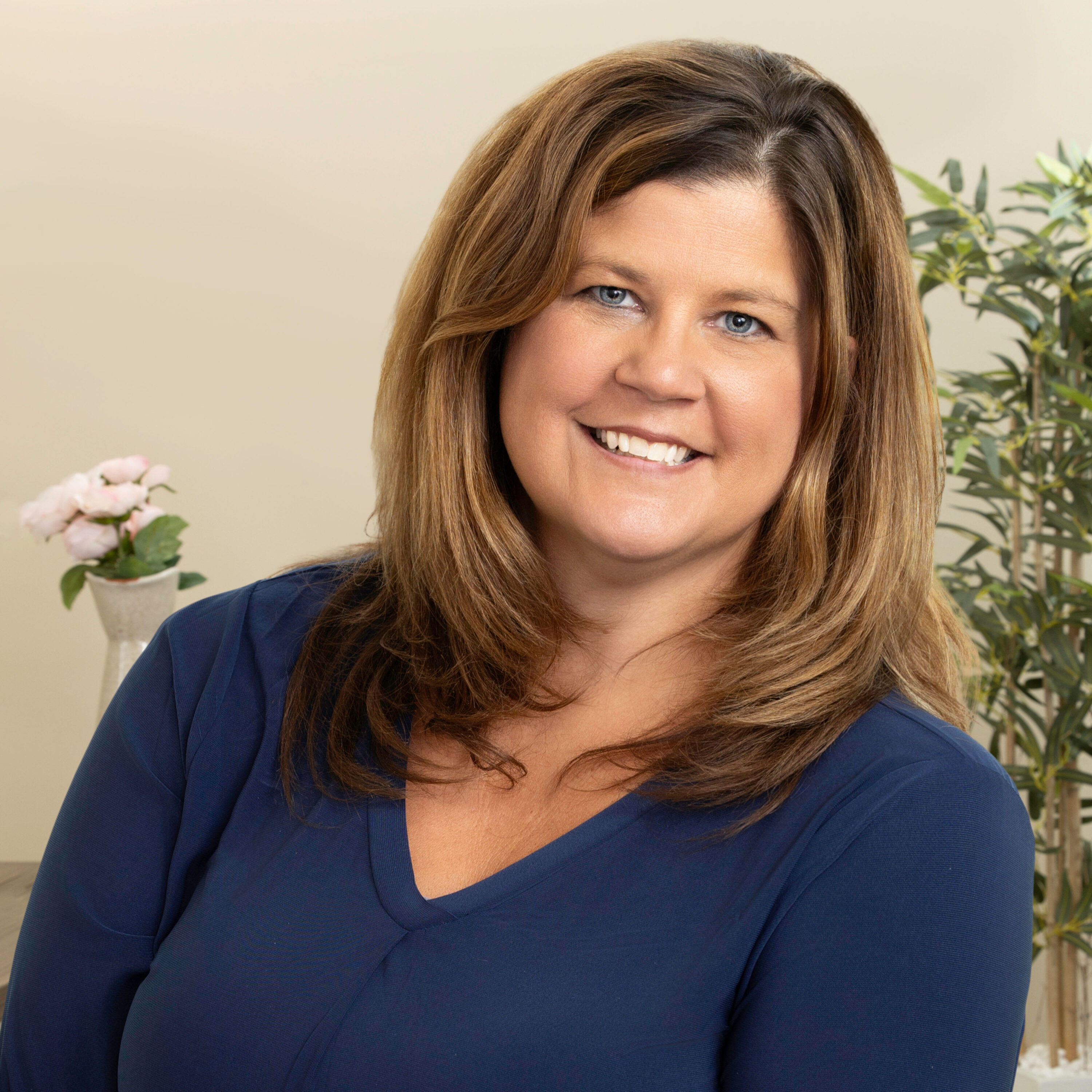Smiling woman in navy top indoors