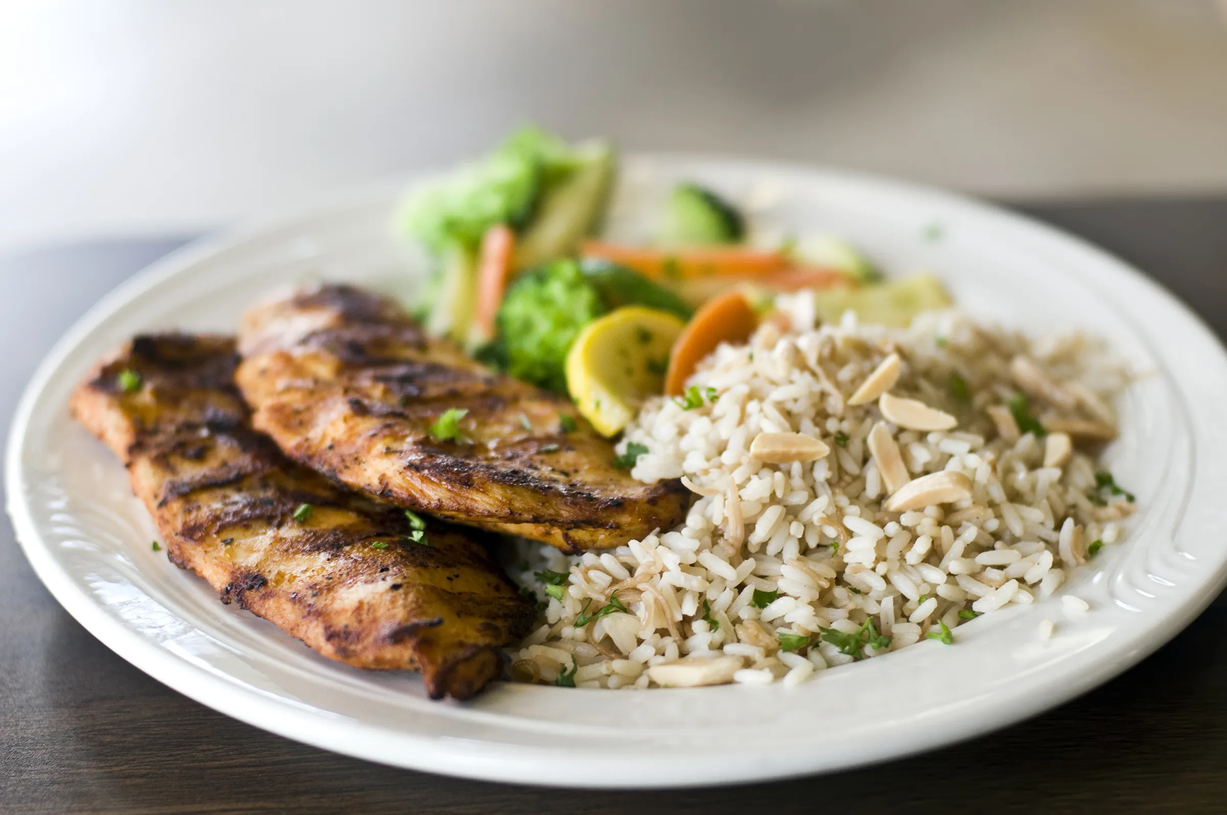 Grilled salmon with almond rice and fresh vegetables